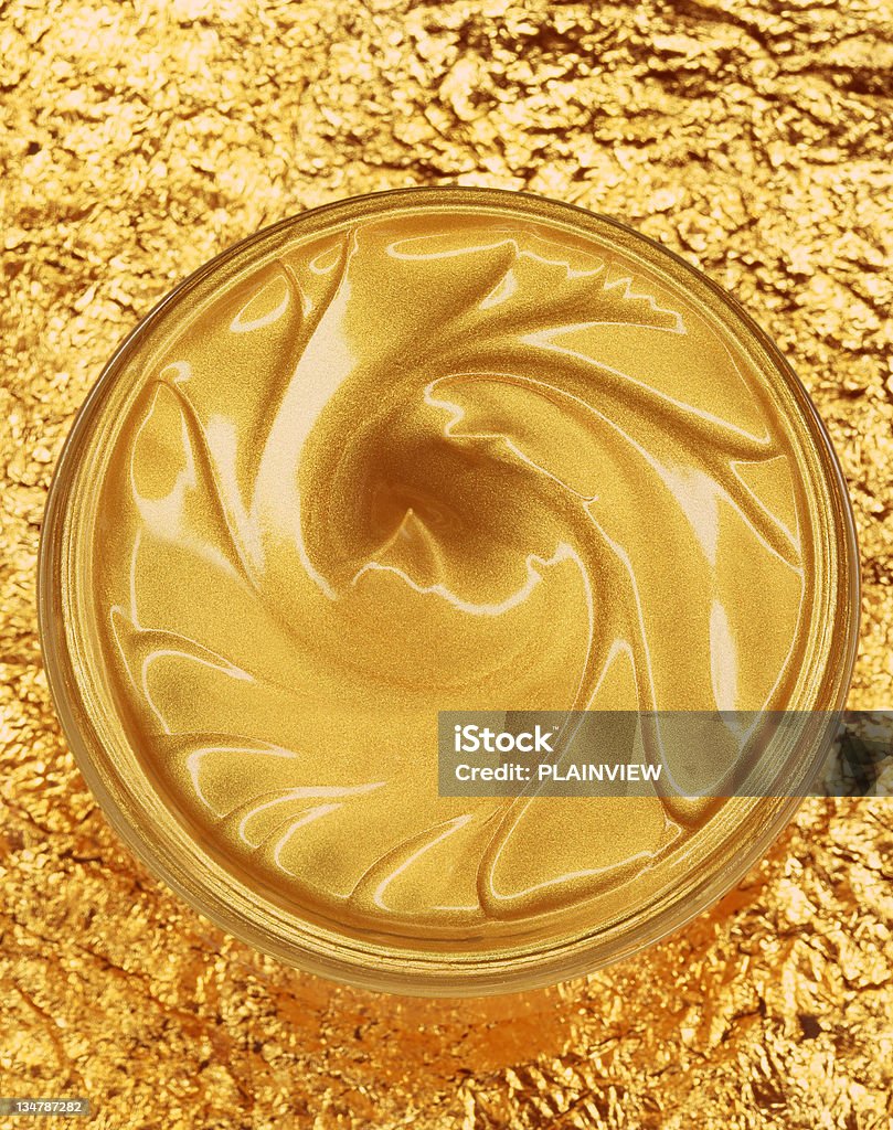 Crema idratante dorato - Foto stock royalty-free di Barattolo di vetro