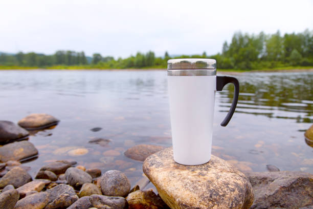 istock White travel mug mockup with river view 1347876767