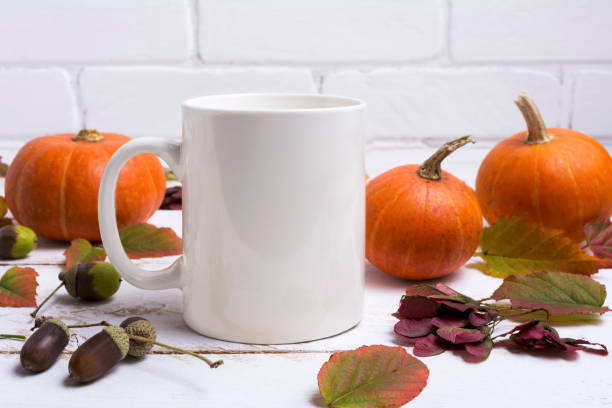 istock Coffee mug mockup thanksgiving with pumpkins, acorns 1347876775