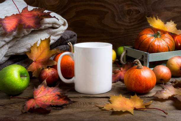 istock Coffee mug mockup thanksgiving with fall leaves, pumpkins 1347876778