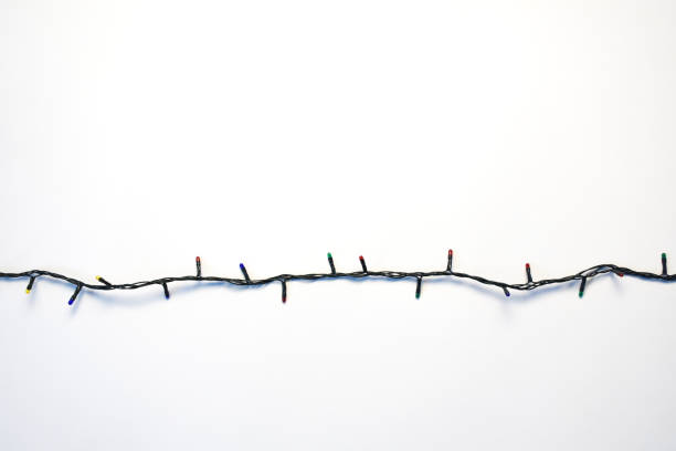istock Christmas lights on the white background 1347878114