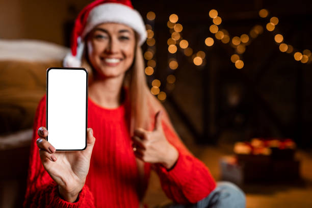 istock Woman showing white empty smartphone screen and like 1347878469