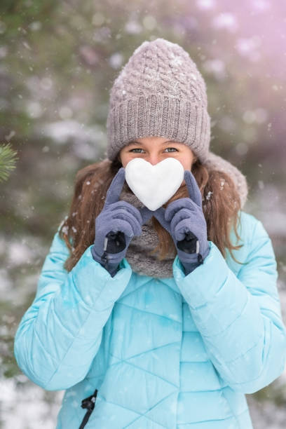 istock Heart in girl's hands 1347878663