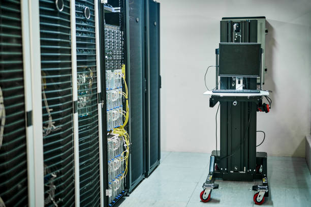 istock Shot of electronic equipment in an empty server room 1347879791