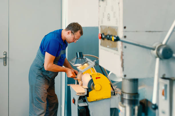 istock The turner sharpens the part on a grinding machine in the workshop 1347879870