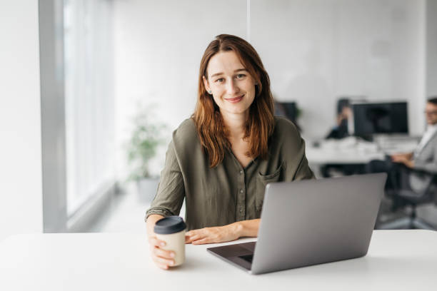 istock Smiling business woman looking at the camera 1347879906