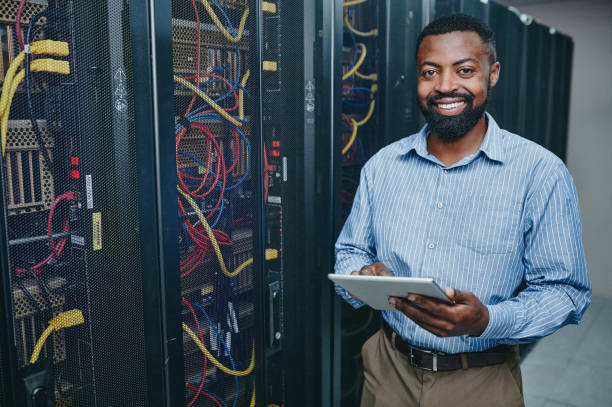 istock Portrait of a young man using a digital tablet while working in a server room 1347880328