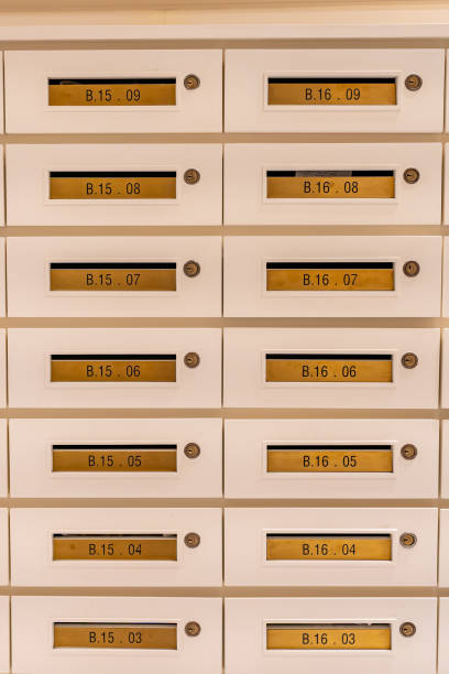 istock Vertical photo of mailbox array at postal room in apartment building 1347881739