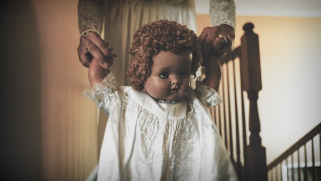 Creepy Doll Being Shook by Obscured Woman