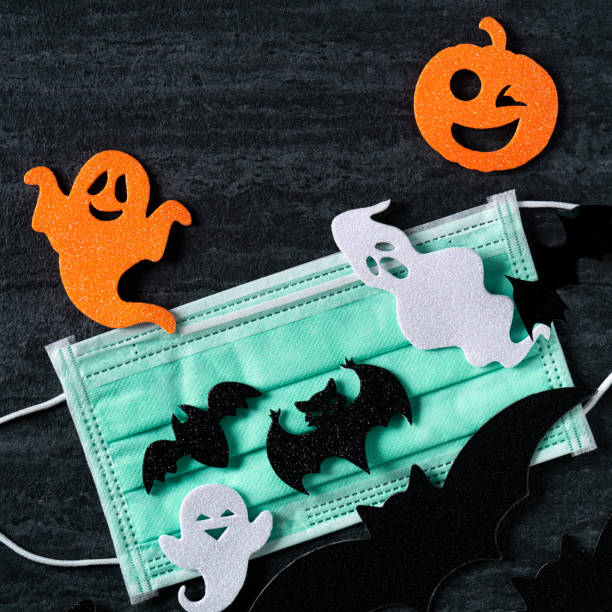 istock Top view of Halloween concept background with mask. 1347884912