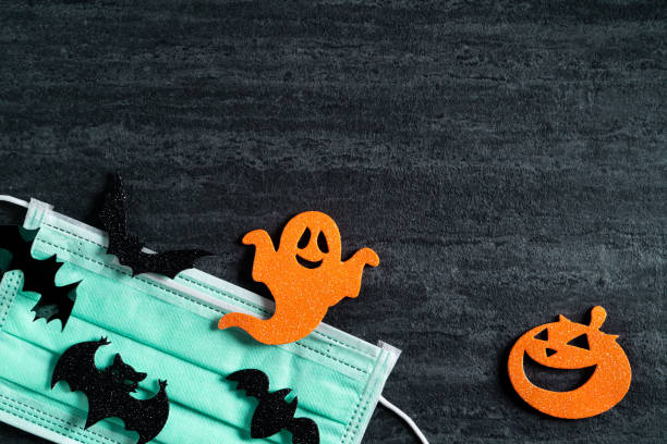 istock Top view of Halloween concept background with mask. 1347884914