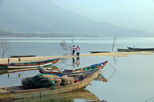 Small fishing boat anchored in Ha Long Bay, Vietnam