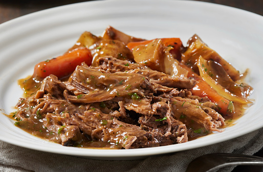 Slow Cooker Pot Roast with Potatoes, Carrots, Celery, Onions and Garlic