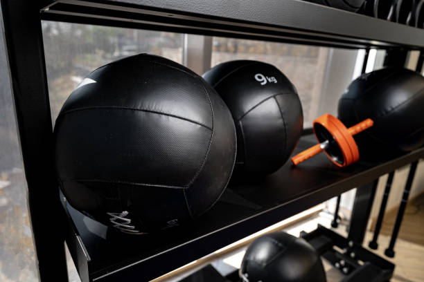 istock Balls and foam roller sport equipment in a gym 1347892985
