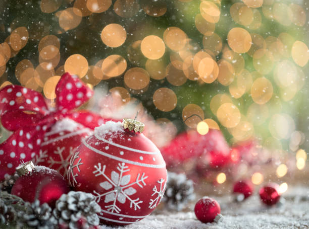 istock Christmas Snowflake Baubles on Christmas Lights Background 1347893302