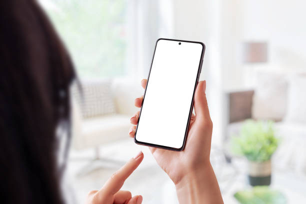istock Modern phone mockup in woman hands 1347894351