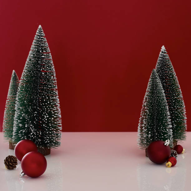 istock Christmas gift box on red background Christmas tree 1347895379