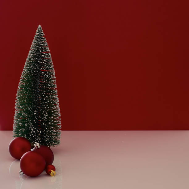 istock Christmas gift box on red background Christmas tree 1347895404