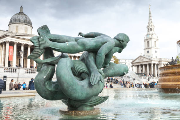 London, United Kingdom - October 29, 2017: Fountain at Trafalgar Square, tourists walk the square