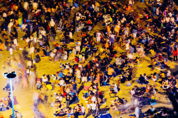 istock Crowd of people on the move at the beach 1347902121