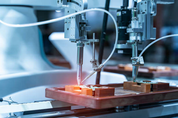 istock automatic robot for print circuit board (PCB)assembly machine during soldering or welding part 1347902180