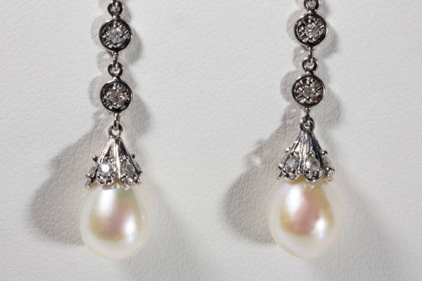 istock Long earrings in white gold, pearls and diamonds 1347903407