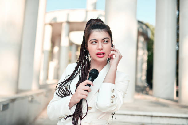 istock Female Journalist Making Report From City Center 1347906047