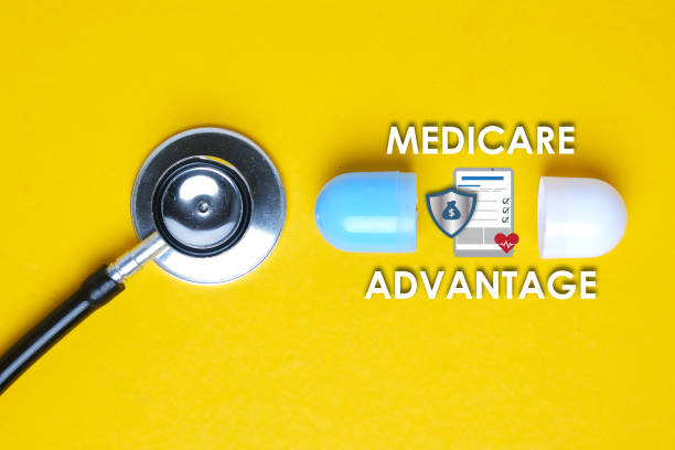 Medicare Advantage A picture of stethoscope with fake capsule, medicare advantage word, tablet, money shield and heart. medicare stock pictures, royalty-free photos & images