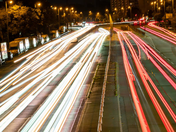 istock light trails on a city highway. Night city 1347907397