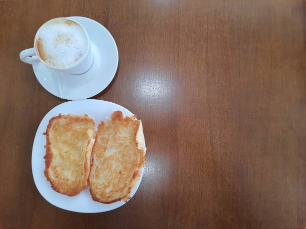 istock French toasted bread with butter on plate with latte 1347909641