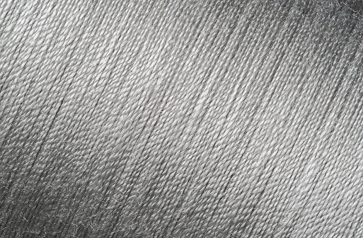 Close up picture of silver thread texture, diagonal line background imange