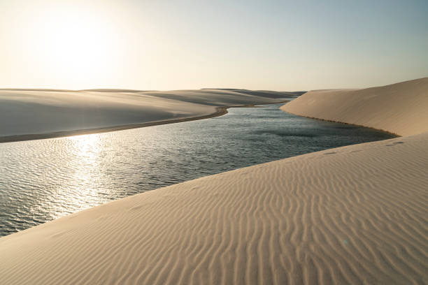 istock Beautiful view to blue rainwater lagoon on white sand dunes 1347910462