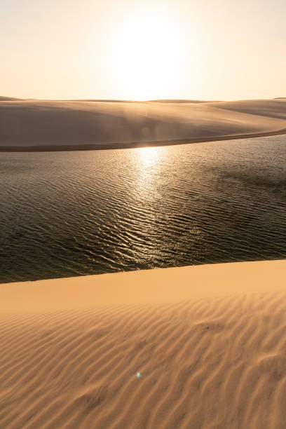 istock Beautiful sunset view to rainwater lagoon on sand dunes 1347910465