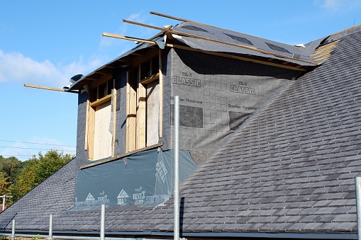 A roof that is partially covered and the roof truss has already been replaced.