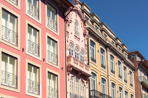 Variation in the colors and styles of apartment building facades in Porto, Portugal.