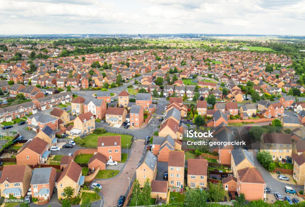 Large modern new build housing estate A high angle view over a large modern housing estate near Leicester in the Midlands of England. Photographed during summer. Housing Development Stock Photo