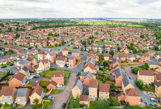 large modern new build housing estate - land development aerial view planning imagens e fotografias de stock