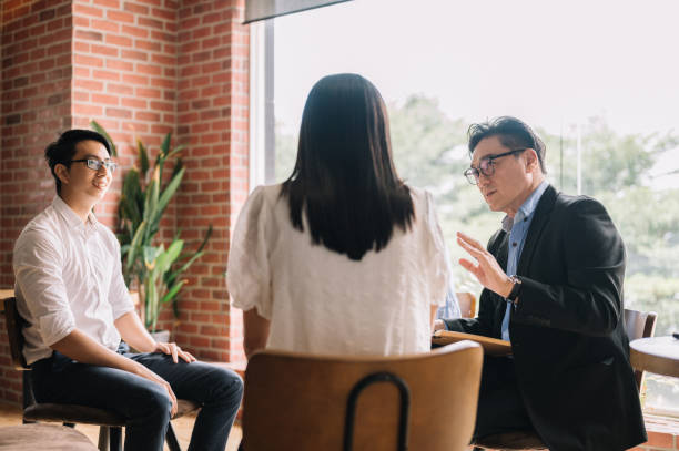 istock Business team sitting in circle and discussing 1347910960