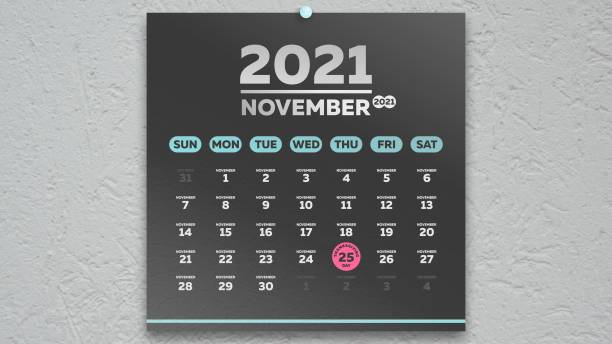 A beautiful black November page of the wall calendar 2021 with a marking Thanksgiving Day date A beautiful black November page of the wall calendar 2021 with a round pink, marking Thanksgiving Day date thanksgiving holiday hours stock pictures, royalty-free photos & images