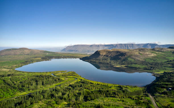 istock Pond in middle of mountainous valley 1347912895