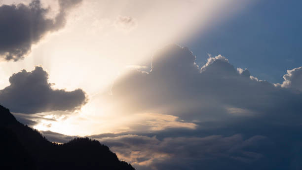 istock spectacular sunbeams through the splendor of clouds in an austrian mountain setting 1347913558