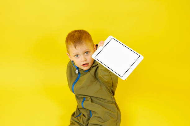 istock The child shows the information on a digital tablet 1347914019