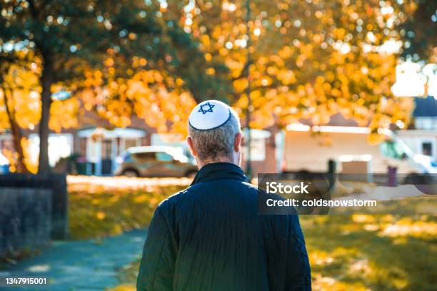 Jewish Man Wearing Skull Cap Walking On Residential Street Stock Photo - Download Image Now