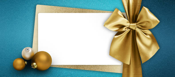 merry christmas gift card, white ticket with golden shiny ribbon bow and xmas balls top view on glittering turquoise background, copy space layout for greeting card, label for shopping, tag sale price merry christmas gift card, white ticket with golden shiny ribbon bow and xmas balls top view on glittering turquoise background, copy space layout for greeting card, label for shopping, tag sale price christmas card photos stock pictures, royalty-free photos & images