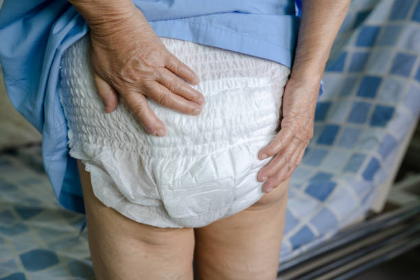 Asian senior or elderly old lady woman patient wearing incontinence diaper in nursing hospital ward, healthy strong medical concept. Asian senior or elderly old lady woman patient wearing incontinence diaper in nursing hospital ward, healthy strong medical concept. adult diaper stock pictures, royalty-free photos & images