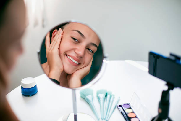 istock Young female vlogger recording a make-up video 1347919877