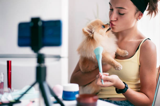 istock Young female vlogger recording a make-up video 1347920916