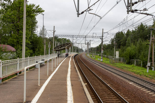 istock Railway station. An empty platform and railway rails in cloudy weather 1347921018