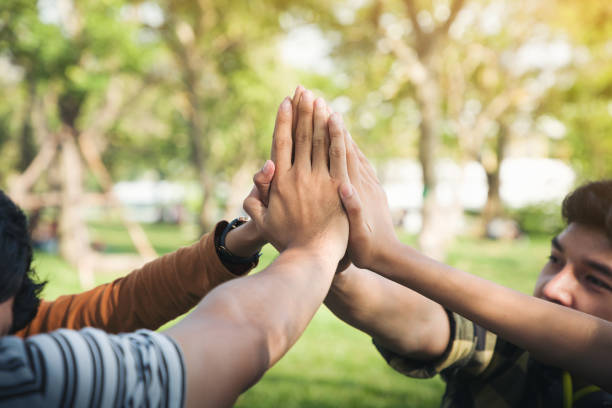 istock Group of teenagers put all hands together,Teamwork Concept, Startup teamwork concept 1347921357