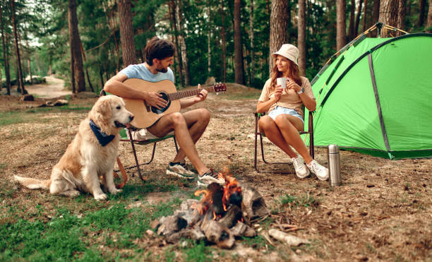 istock Family with dog in the forest 1347923964